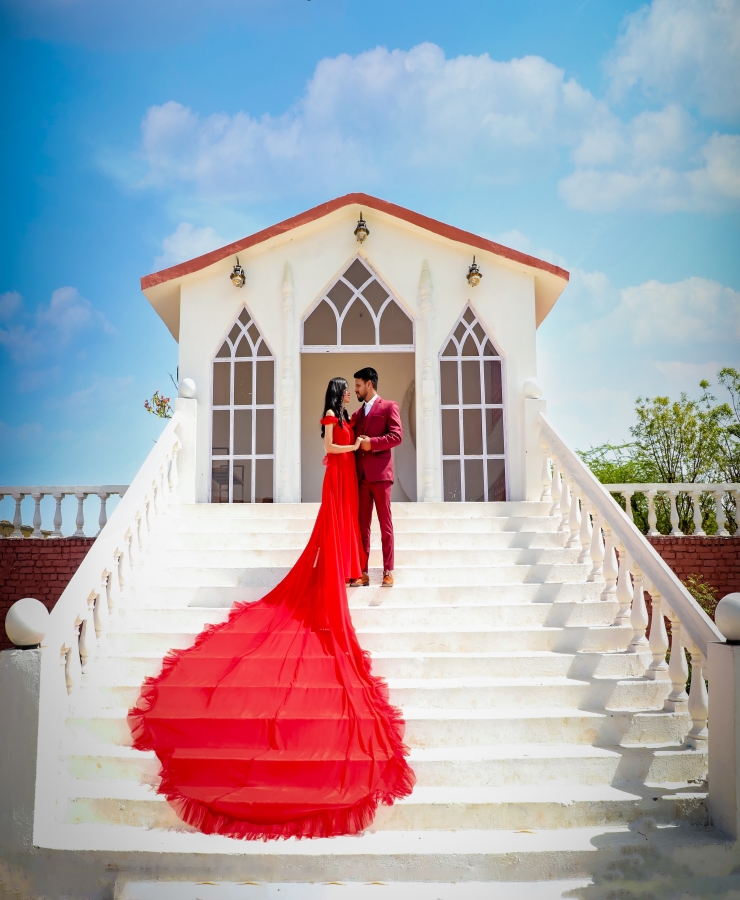 Red georgette half sleeves tail gown