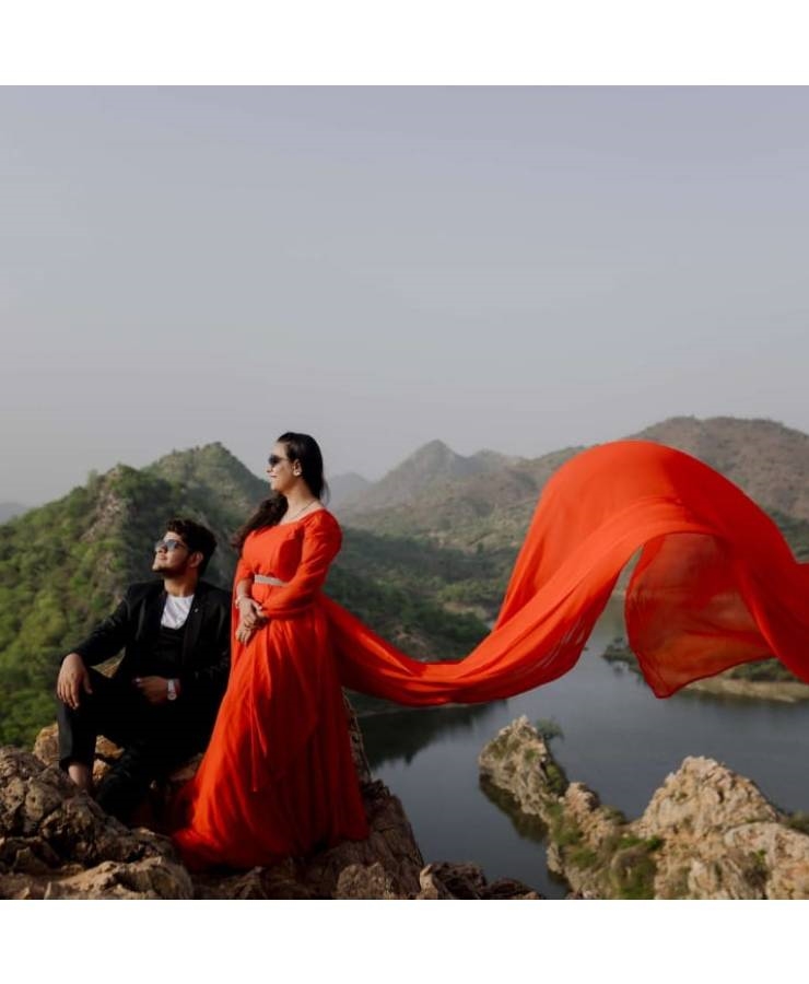 Red georgette full sleeves tail gown